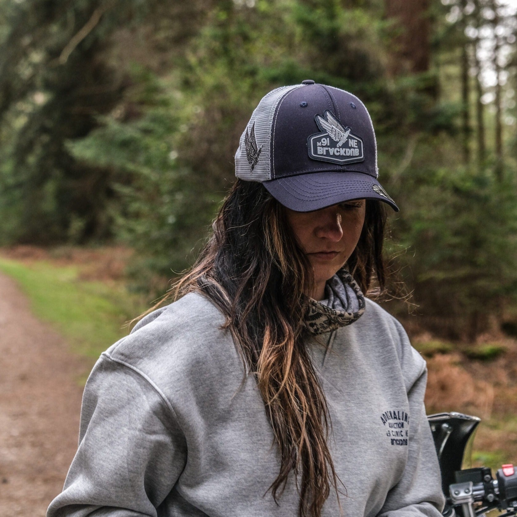 a Uggly&Co flat track cap with Wreckitwren and the royal enfield in the new forest